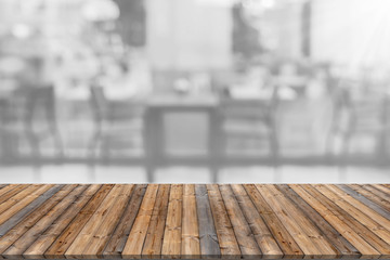 Wooden table with blur restaurant background