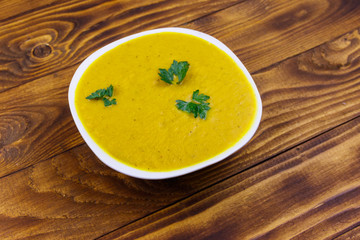 Pumpkin soup on a wooden table