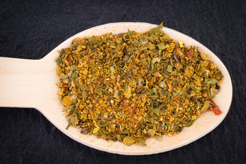  Various spices spoons on dark background. Top view