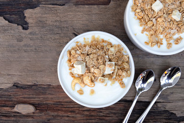 Yogurt  In white glass wood background from top view.