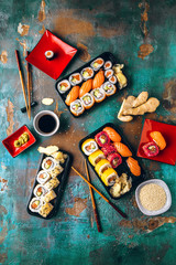 Gourmet traditional sushi set with ginger, chopsticks and soy sauce 