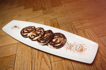 Plate with food on a wooden table.