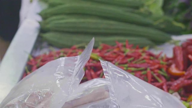 Fresh and Large Red Chili in Traditional Market - Hand Held 