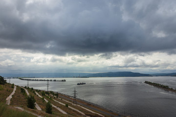 Volga river and breakwater in cloudy weather - 296115836