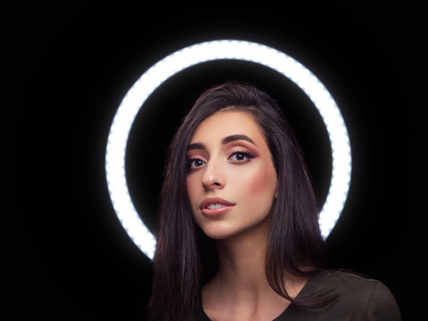 Beautiful young caucasian woman trendy look portrait with ring light halo  black background for makeup artist portfolio in film effect colors Stock  Photo | Adobe Stock