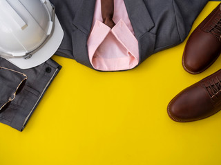 Men fashion clothing set and accessories isolated on a yellow background. Project manager clothes concept, Top view