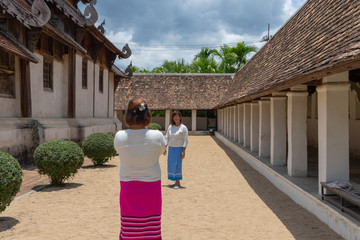 Twins asian women happiness in Chiang Mai on holiday with North style dressing.