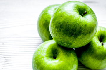 ripe green apples white table background
