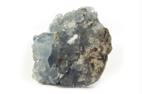 Rock of blue celestine mineral from Madagascar isolated on a pure white background