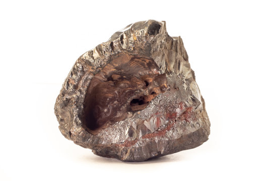 Rock of shiny goethite mineral from Morocco isolated on pure white background.