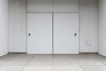 sidewalk by street wall & door