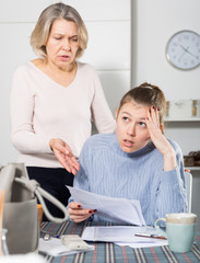 Fototapeta premium Unhappy woman with documents, family quarrel