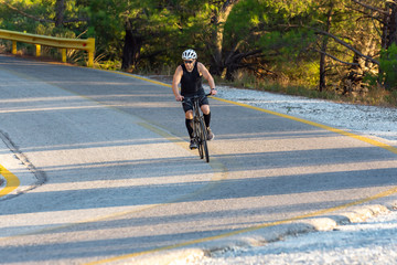 male biker cycling on a mountain road