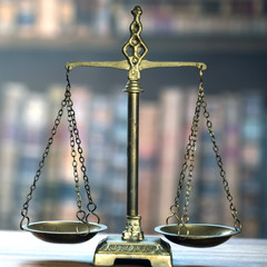 Law and Justice concept. Mallet of the judge, books, scales of justice. Courtroom theme.