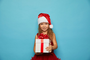 Child  in Santa red hat