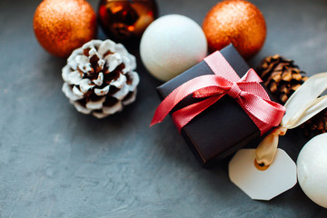 Christmas and New Year holiday background and wallpaper. Christmas decoration toys on a light gray background. Preparation for winter holidays