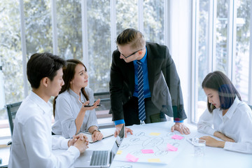 Young business people are presented marketing work project to the customer in meeting room office