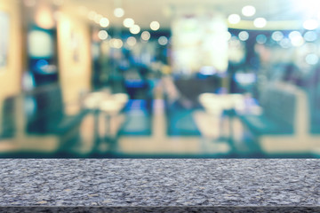Marble table with restaurant blur background
