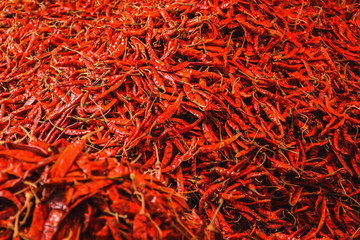 Group of dry red chili heap for sale in market.