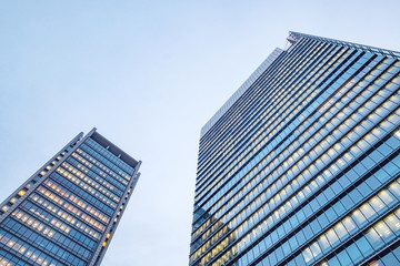 Obraz na płótnie Canvas Windows of skyscraper business office buildings, Corporate building in Tokyo City, Japan. Business concept.