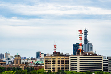 Mast telecommunication TV Antenna Tower wireless satellite on building city, television Antenna on blue sky background. 