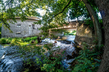 Fototapeta na wymiar hdri panorama near abandoned water mill narrow fast river in sunny morning