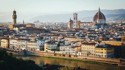 Fototapeta na wymiar Florence city. Panoramic view to the river Arno, with Ponte Vecchio, Palazzo Vecchio and Cathedral of Santa Maria del Fiore ,Duomo.