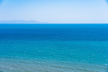 Beautiful sea or ocean view in blue color in layer tone , sea view from mountain or hill , sunrise to seascape with clear blue sky clouds.