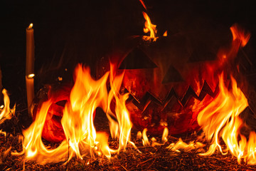 Fototapeta premium Jack-o-lantern. Flaming pumpkin. The symbol of Halloween.