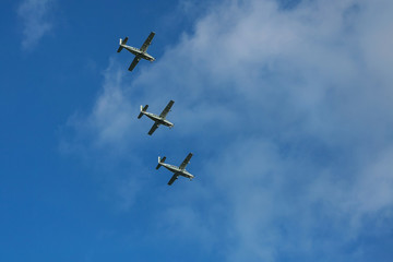 Plane made artificial rain in blue sky airplane fly bright air