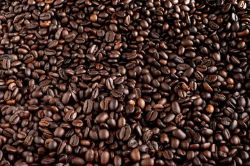 Roasted coffee beans background, arabica and robusta.