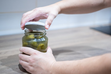 Pickled cucumbers, gherkins, dill, vegetable, food photography, unscrew lid