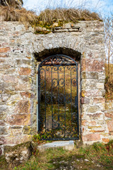 Beautiful old door to Kronenburg Castle ruins in winter, at Kronenburg, North Rhine-Westphalia, Germany