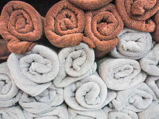 Obraz na płótnie Canvas spa towels, towels stacked rolls. texture background