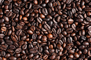 Roasted coffee beans background, arabica and robusta.