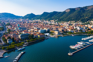 Fototapeta na wymiar Aerial view of city center Como with embankment of lake Como. Italy