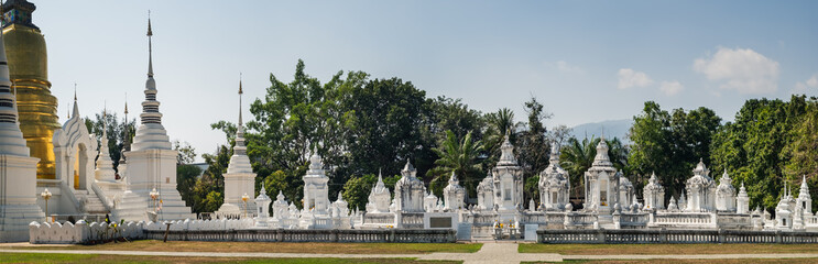 Fototapeta na wymiar Panoramic view of golden and white pagoda at Wat Suan Dok Temple in Chiang Mai, Thailand.