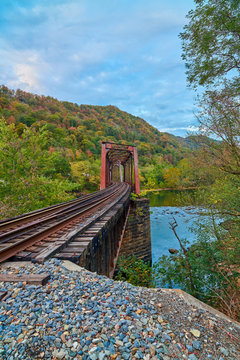 Railroad trestle with fall colors and the New River, WV.
