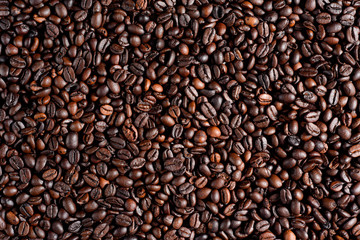 Roasted coffee beans background, arabica and robusta.