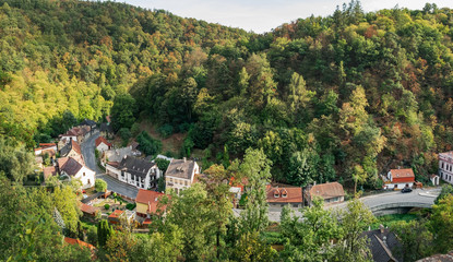 Fototapeta na wymiar Panoramic summer view from famous medieval Krivoklat Castle on Krivoklat town in Bohemia, Czech Republic.
