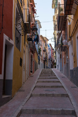 Fototapeta na wymiar Stairs in a narrow street