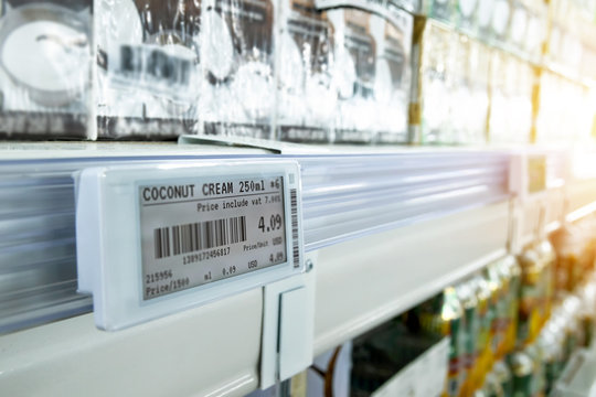 Smart retail digital store technology concept.Electronic Shelf Label(ESL) led for automatically updated displaying product pricing on shelves for retail business. Price is change from control service.