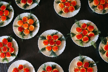 Red caviar tartlets. Top view of red caviar in a plate