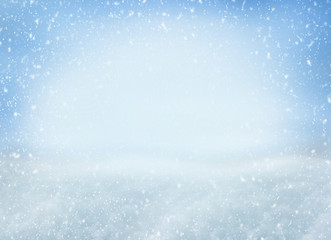 Winter Christmas background with falling snowflakes on blue background. Background for design with...