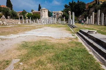 Tourists visiting the ancient ruins at the Roman Agora located to the north of the Acropolis in Athens