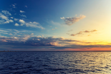 Beautiful nature background with clouds on sunset.