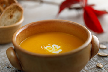 Pumpkin cream soup in a ceramic dish