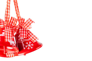 Isolated red Christmas bells with craft ribbons. Christmas and New Year holidays celebration concept with copy space.