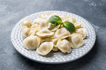 Dumplings stuffed with meat, ravioli, dumplings. Dumplings with stuffing. Russian cuisine.