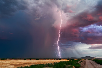 Lightning bolt strike and storm cloud